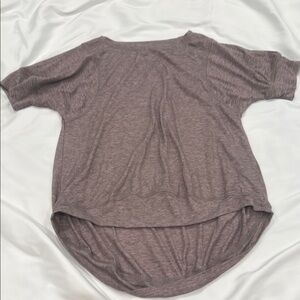 Heathered purple Short Sleeve Top covers bottom